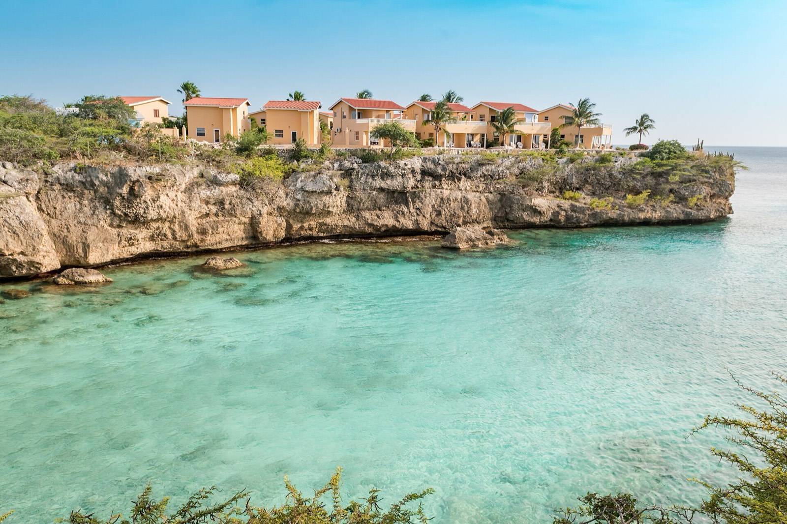 The narrow cove of Playa Lagun framed by cliffs on the west coast of Curaçao