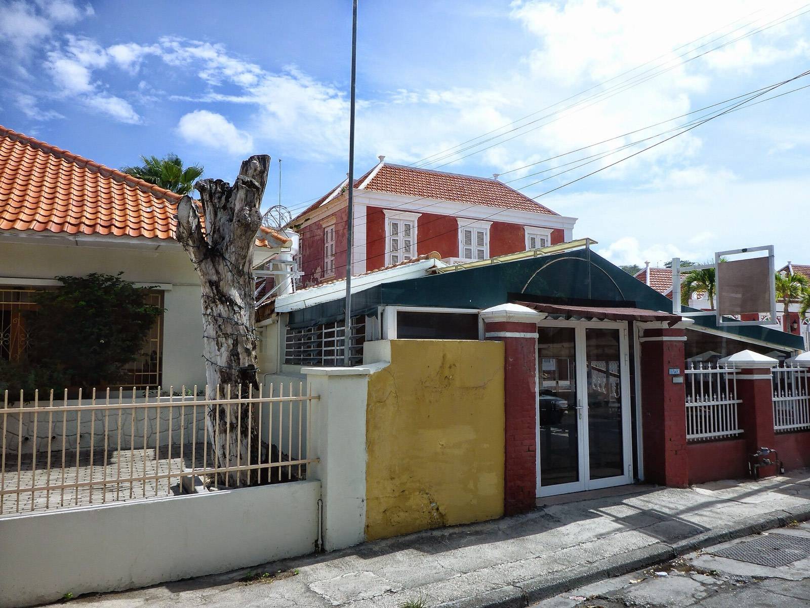 Restored historic mansions along a quiet street in the Scharloo quarter of Willemstad