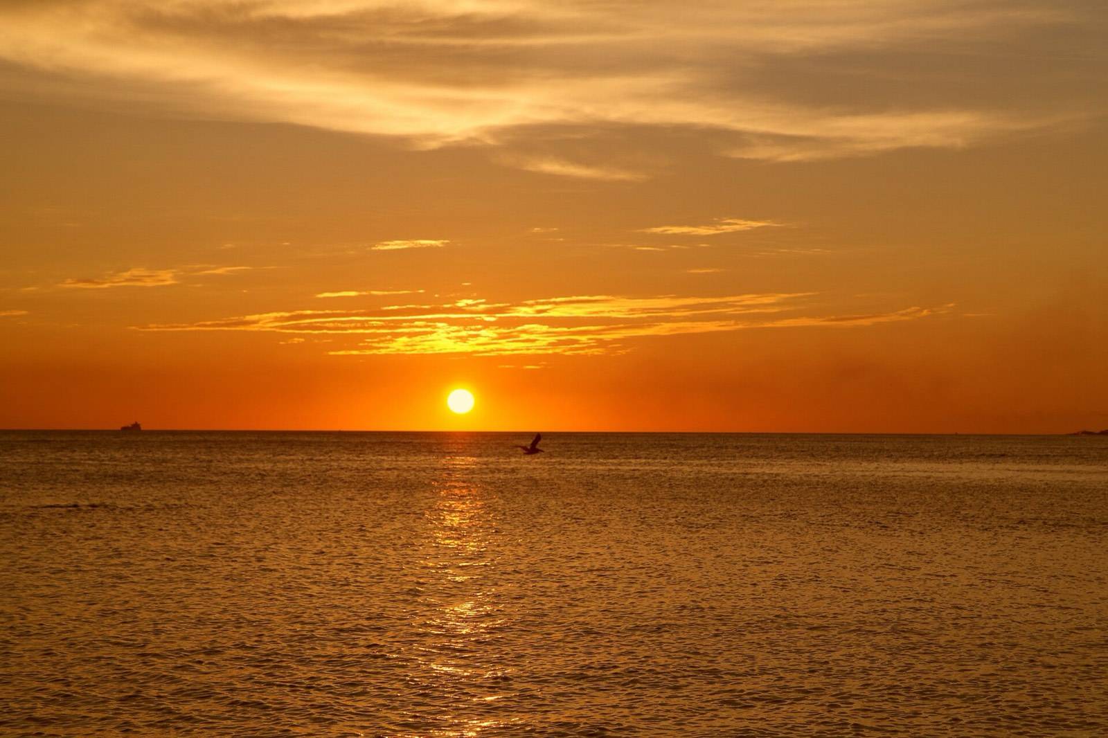 The sun setting over calm water at Jan Thiel on the southeastern coast of Curaçao